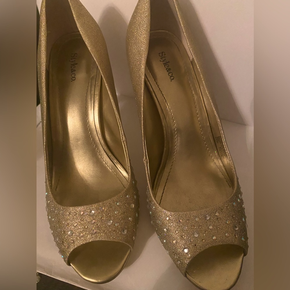 Gold sparkly all over/little stud sparkles on the front. Scratches underneath.